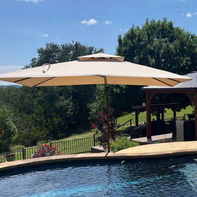 Avalynn 12' x 9' Rectangular Umbrella with Counter Weights with Base in Ground
