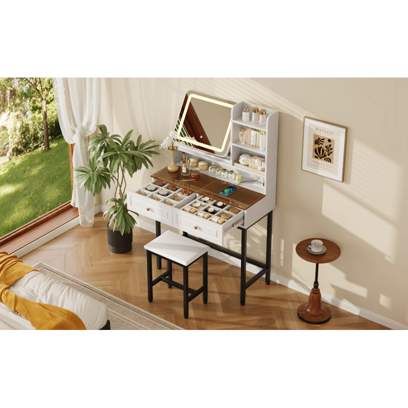 Coiffeuse de maquillage avec miroir rotatif à 360 ° éclairé par DEL, 2 tiroirs, prises de courant et tablettes à 3 niveaux, plateau en verre ambré, pieds en métal et tabouret