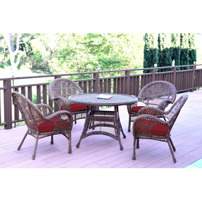 Mangum 4 - Person Wicker Patio Dining Set with Round Table
