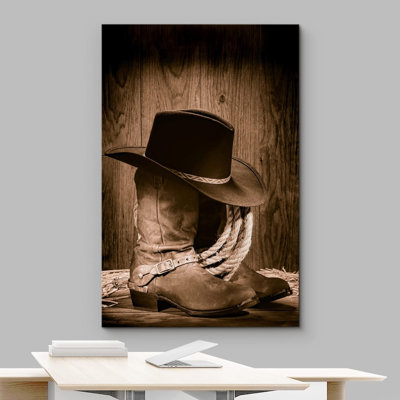 " Cowboy Black Hat Atop Western Boots "
