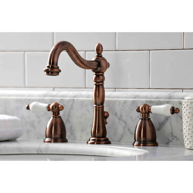 Kingston Brass Heritage Two-Handle 3-Hole Deck Mount Widespread Bathroom Faucet with Brass Pop-Up Drain, Antique Copper