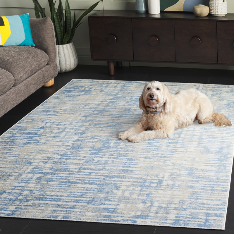 Ivory and Blue Abstract Synthetic Rectangular Area Rug