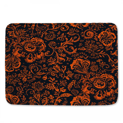 Tapis de bain orange à motif floral