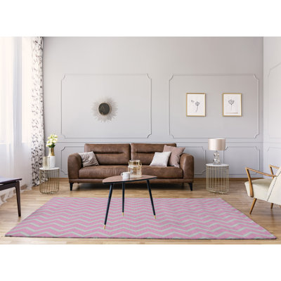 Tapis rose/gris à chevrons à main