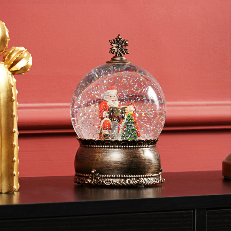 Boule à neige musicale avec paillettes tourbillonnantes