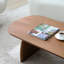 Table basse ovale en bois massif, finition noyer lisse, support incurvé pour un poids uniforme, plateau elliptique créatif multi-fonctions, support, ajoute de l'art à la maison-145236706