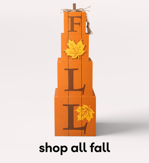 Stacked FALL letter block decoration with autumn leaves.