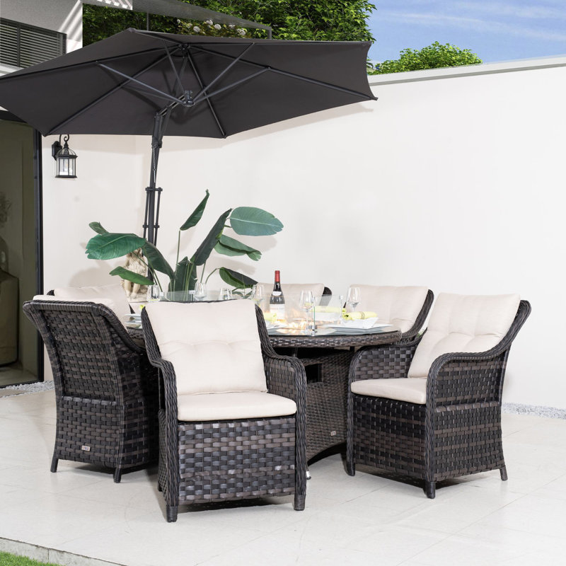 Ensemble repas de patio en osier pour 6 personnes avec table ovale Omied, coussins inclus