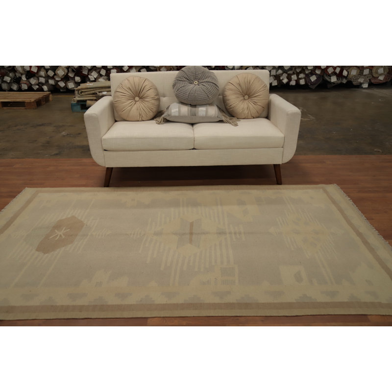 Tapis tons terreux dans un kilim géométrique 5 x 8 pour espaces confortables