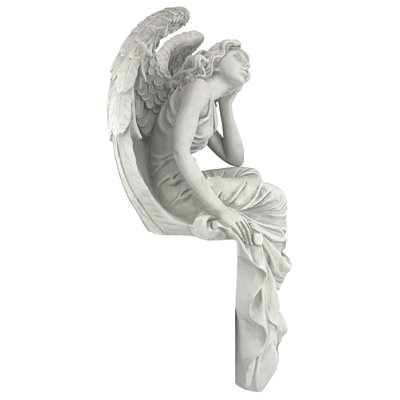 Statue ange assis reposant grâce
