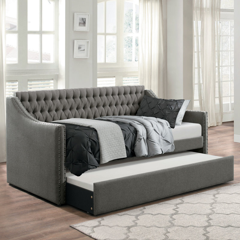 Canapé-lit moderne capitonné en tissu gris foncé de conception moderne avec lit gigogne et garniture cloutée