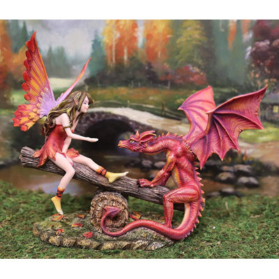 Figurine Struthers Elf Fire Fairy avec dragon assis sur des bûches de forêt