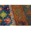 Tapis géométrique bleu / orange / rouge en laine noué à la main Laudalino