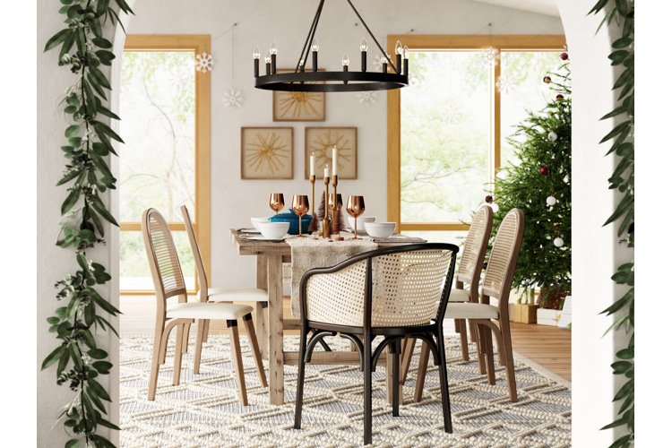modern dining room with light neutral colors and a full Christmas tree
