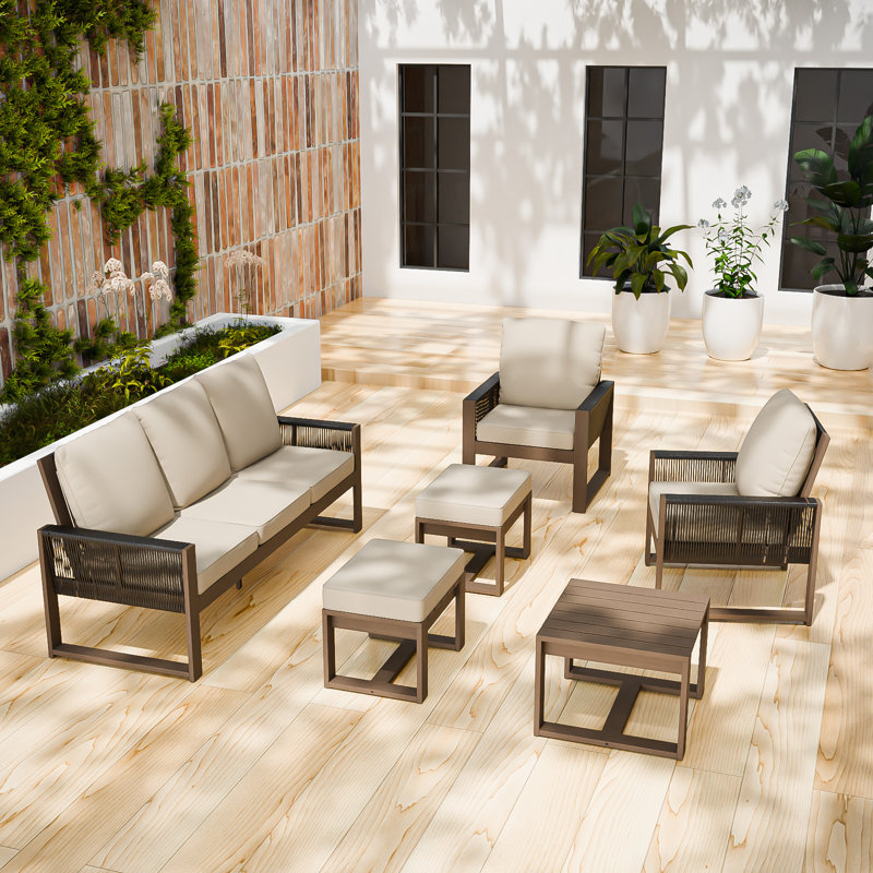 Ensemble de conversation 6 pièces avec canapé en bois de cèdre brun et osier gris avec coussins en oléfine, table basse carrée et repose-pieds