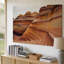 Toile vue rapprochée de formes complexes de grès coulant dans un art mural, tons chauds d'orange et de brun, mettant en valeur la toile lisse-244820614