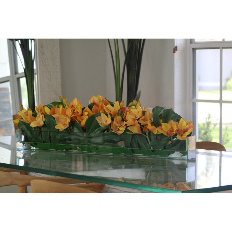 36" Casa Moderna Glass Plate Planter With Yellow Cymbidium Orchids And Monstera Leaves