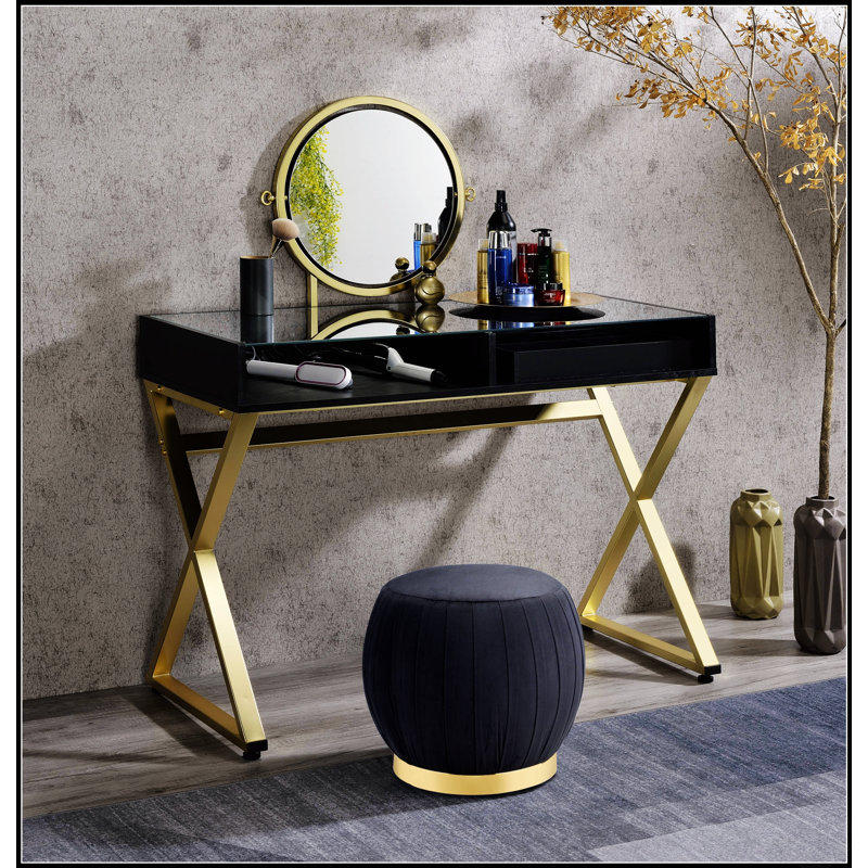 Bureau de coiffeuse Coleen avec miroir et plateau à bijoux, finition noire et dorée pour des routines de beauté élégantes