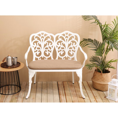 Banc ergonomique en fonte d'aluminium avec motif floral rose et coussin blanc pour les espaces extérieurs