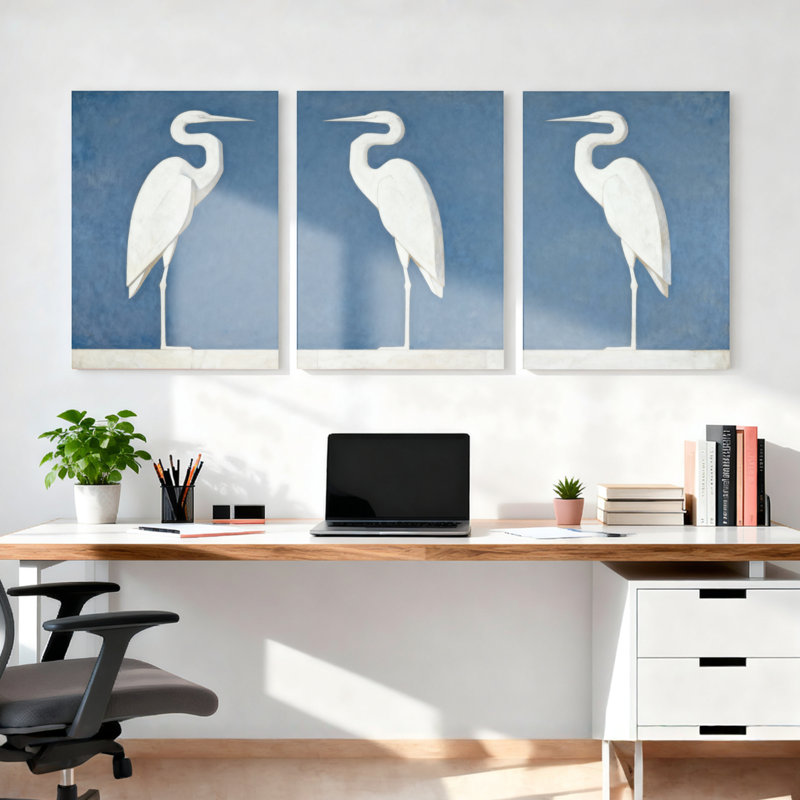 Ensemble de 3 tableaux sur toile tendue représentant un héron blanc sur fond bleu, H 18 po x l 36 po