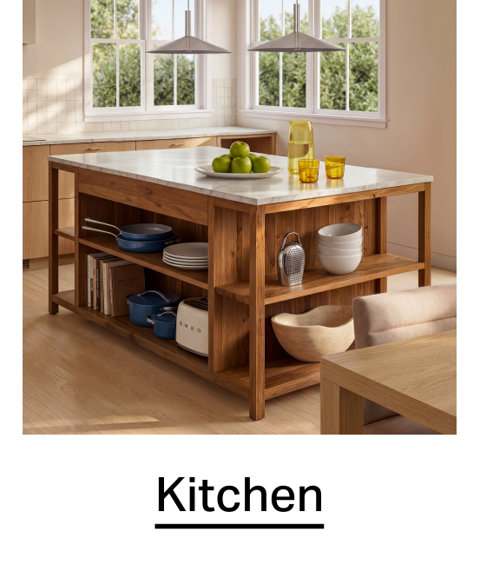 Kitchen wood kitchen island with a marble countertop, open shelving, and organized kitchenware in a bright, modern kitchen.