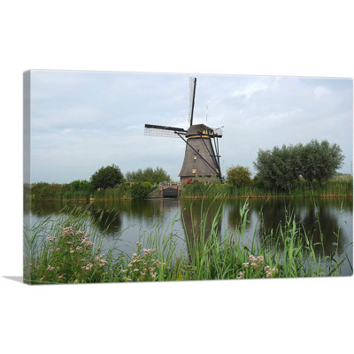Pays-Bas, moulin à vent sur une rivière - reproduction de photo sur toile tendue