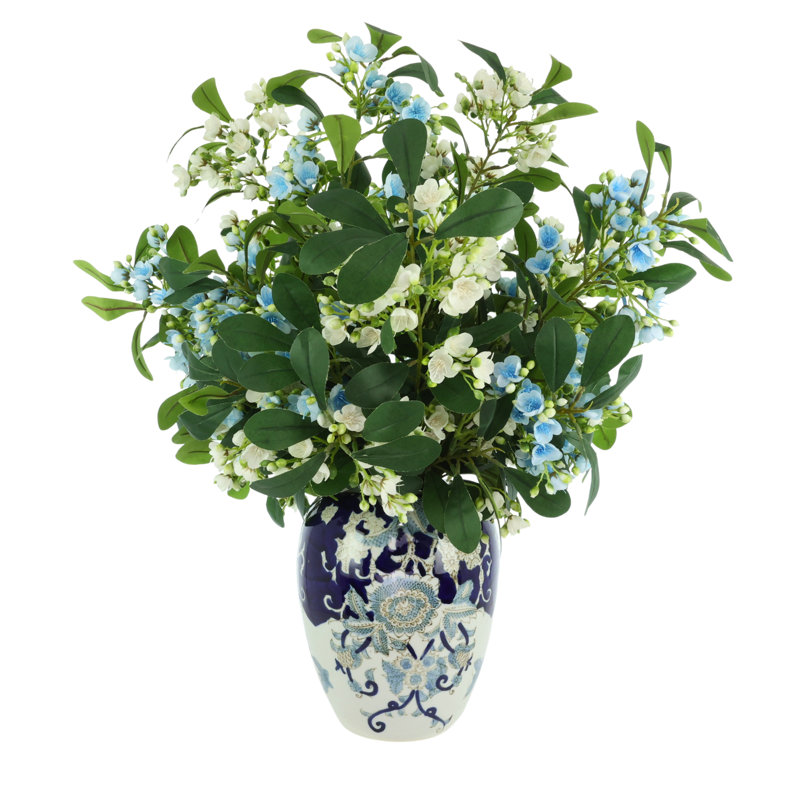 Tiges en herbe dans un vase décoratif, Bleu ; blanc