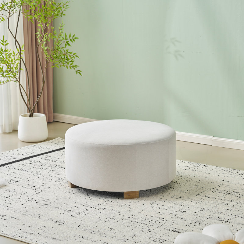Repose-pieds rond en tissu avec pieds