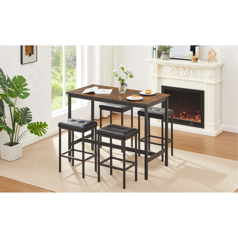 Ensemble de table de pub de style industriel avec chaises en cuir synthétique Geoffory pour manger et recevoir