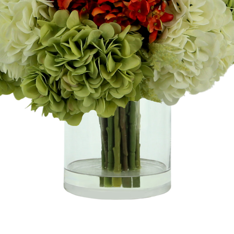 Assorted Hydrangea In A Round Vase
