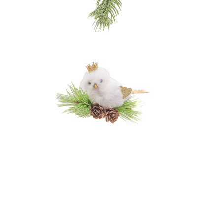 Oiseau royal blanc / doré perché sur une branche royale
