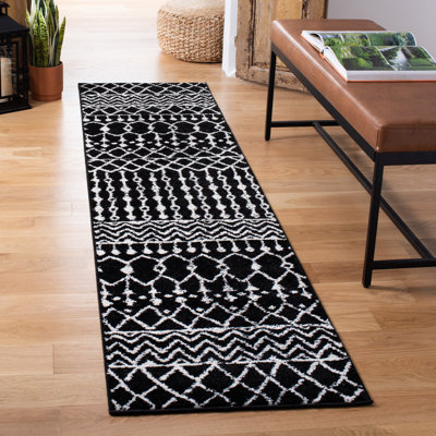 Tapis noir / ivoire à motif géométrique Cobos
