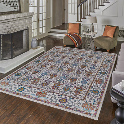 Tapis ivoire à bordure multicolore à motif floral marocain Isabella Radnar