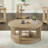 Ashal 40" Wide Coastal Round Cocktail Table in Sand Oak with Casters
