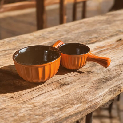 Set of Matt orange reactive glaze handled bowls small and large