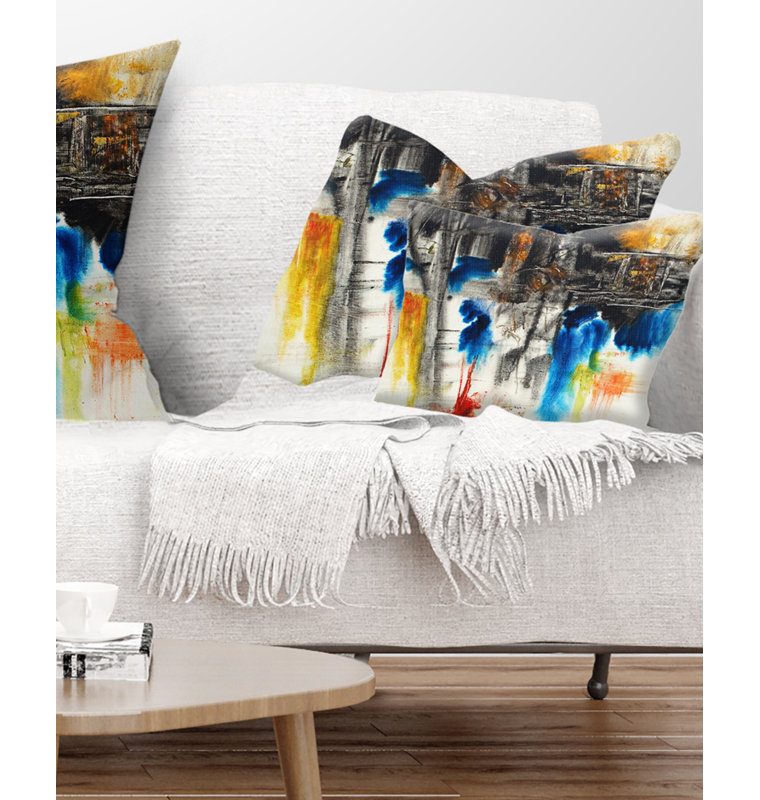 Coussin décoratif à motif abstrait noir, bleu et jaune