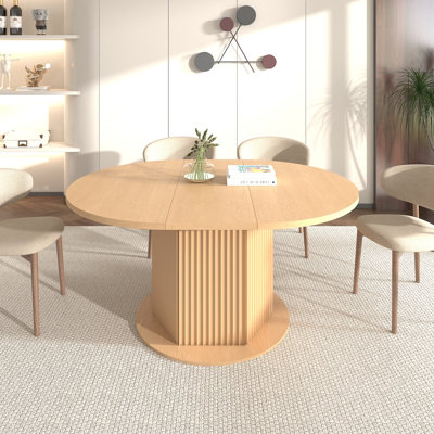Table de salle à manger ronde avec base à texture bosselée