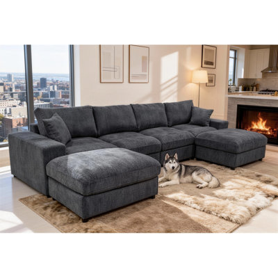 Canapé modulaire avec deux repose-pieds et coussins décoratifs