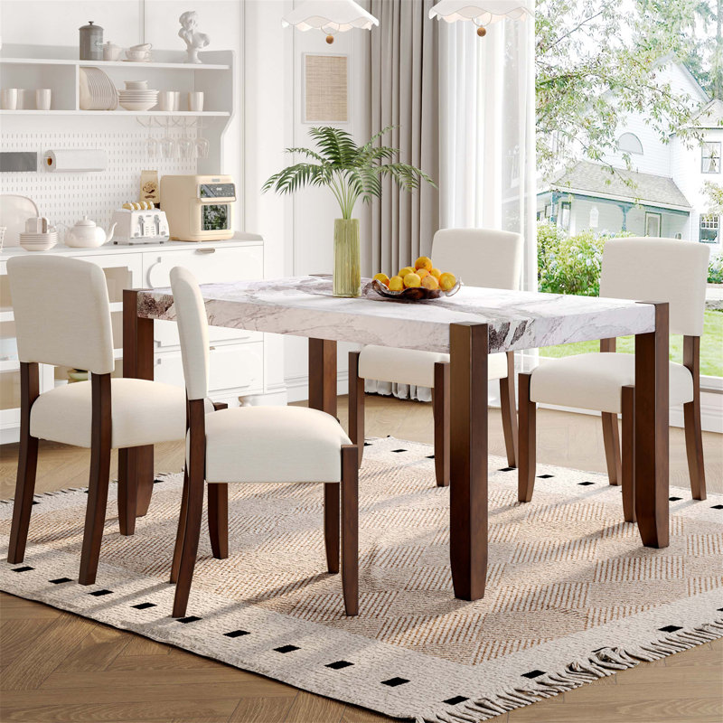 Ensemble de salle à manger 5 pièces en faux marbre avec 4 chaises rembourrées, des pieds en bois d'hévéa massif, des sièges rembourrés et des dossiers courbés pour une salle à manger élégante et confortable