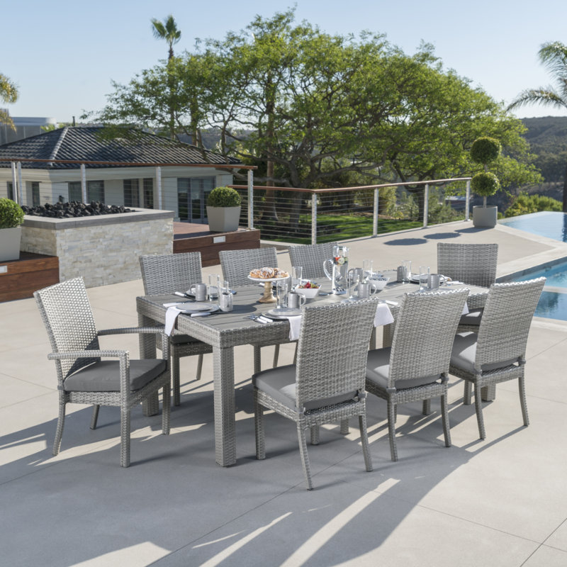 Fionnula 8-Person Rectangular Patio Dining Set with Sunbrella Cushions, Gray Frame/Charcoal Gray Cushion