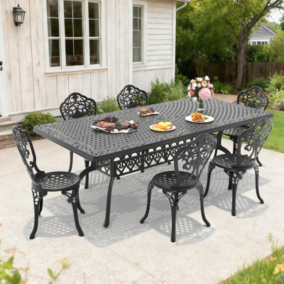 Ensemble de salle à manger d'extérieur 7 pièces en fonte d'aluminium, table rectangulaire de 210 cm de long avec trou pour parasol et 6 chaises avec une largeur d'assise de 39 cm.