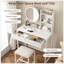 Bureau de coiffeuse compact avec miroir DEL, éclairage réglable, prise de courant, tiroir, tablettes et tabouret rembourré pour les petits espaces-129911221