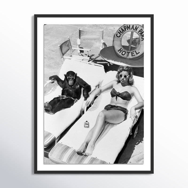 Woman Sunbathing with Chimpanzee by Getty Images, 48" H x 36" W, Black Maple Framed