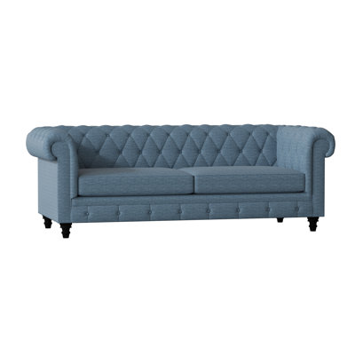 Canapé Chesterfield à accoudoirs roulés
