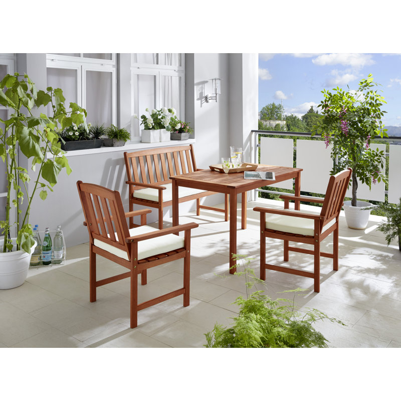 France 4 - Person Eucalyptus Solid Wood Patio Dining Set Umbrella Hole Included Rectangular Table with Cushions Included