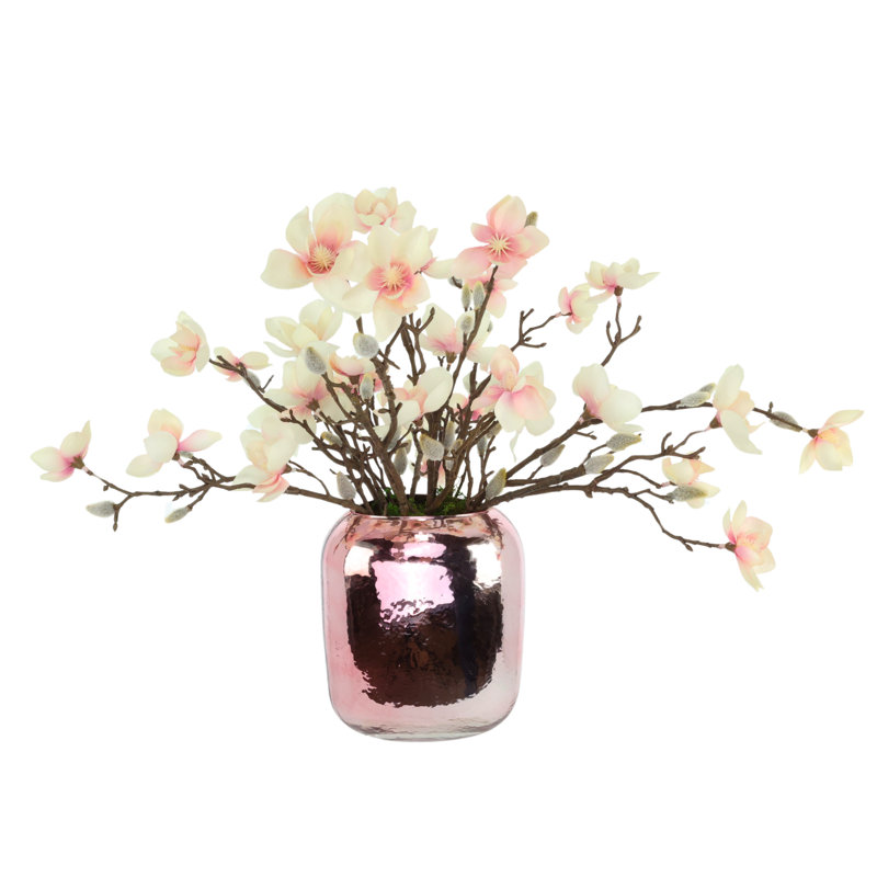 Papillons magnolia dans un vase en verre