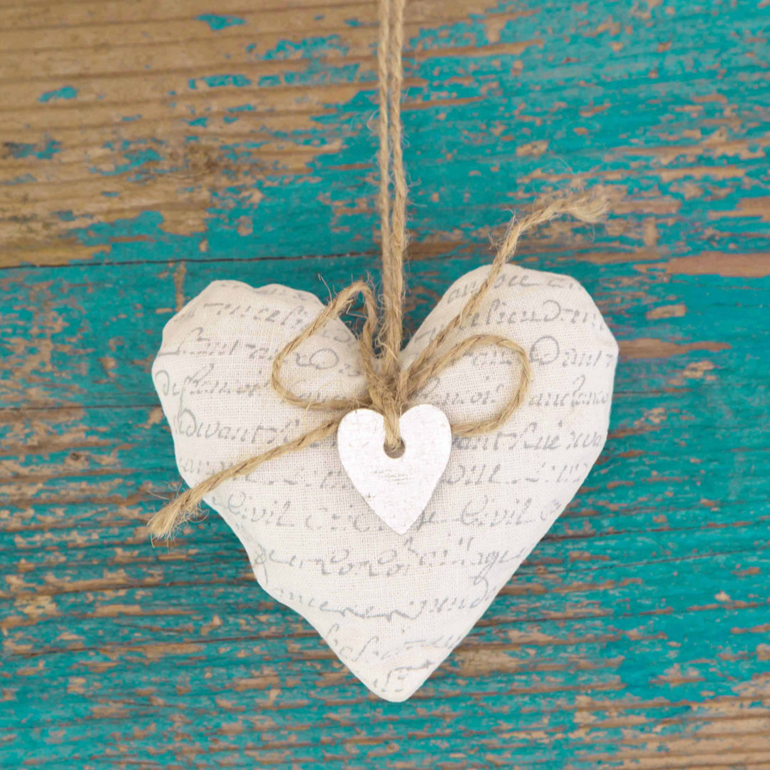 Leinwandbild Hanging Heart and Turquoise Wooden Background von Frizzantine