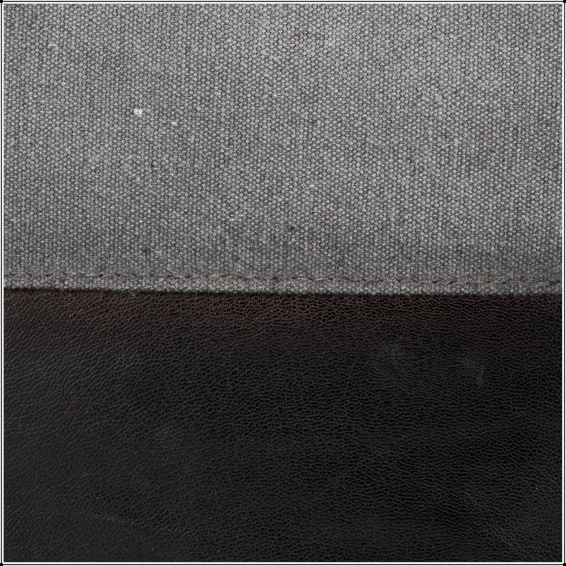 Élégant repose-pieds carré en cuir et toile, parfait pour les sièges supplémentaires et les repose-pieds dans les décors modernes.