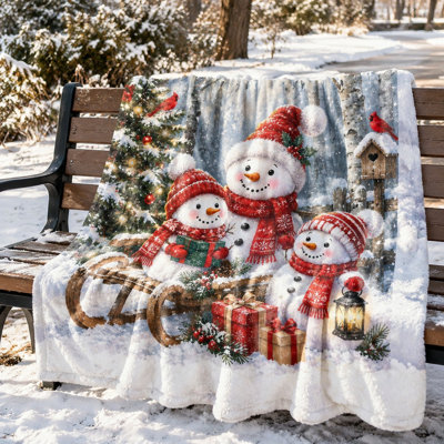Couverture polaire douce et confortable avec motif bonhomme de neige et traîneau, idéale pour canapé, chambre ou salon. Cadeau de Noël.