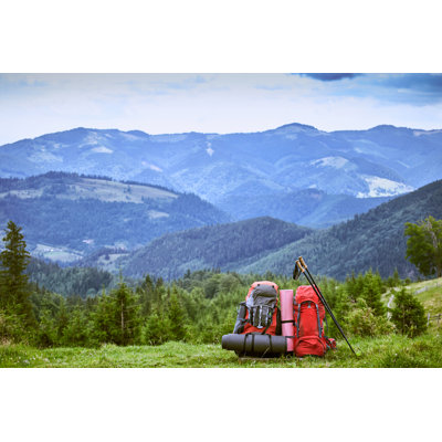 Backpacks In The Mountains by Bondariev - Wrapped Canvas Print